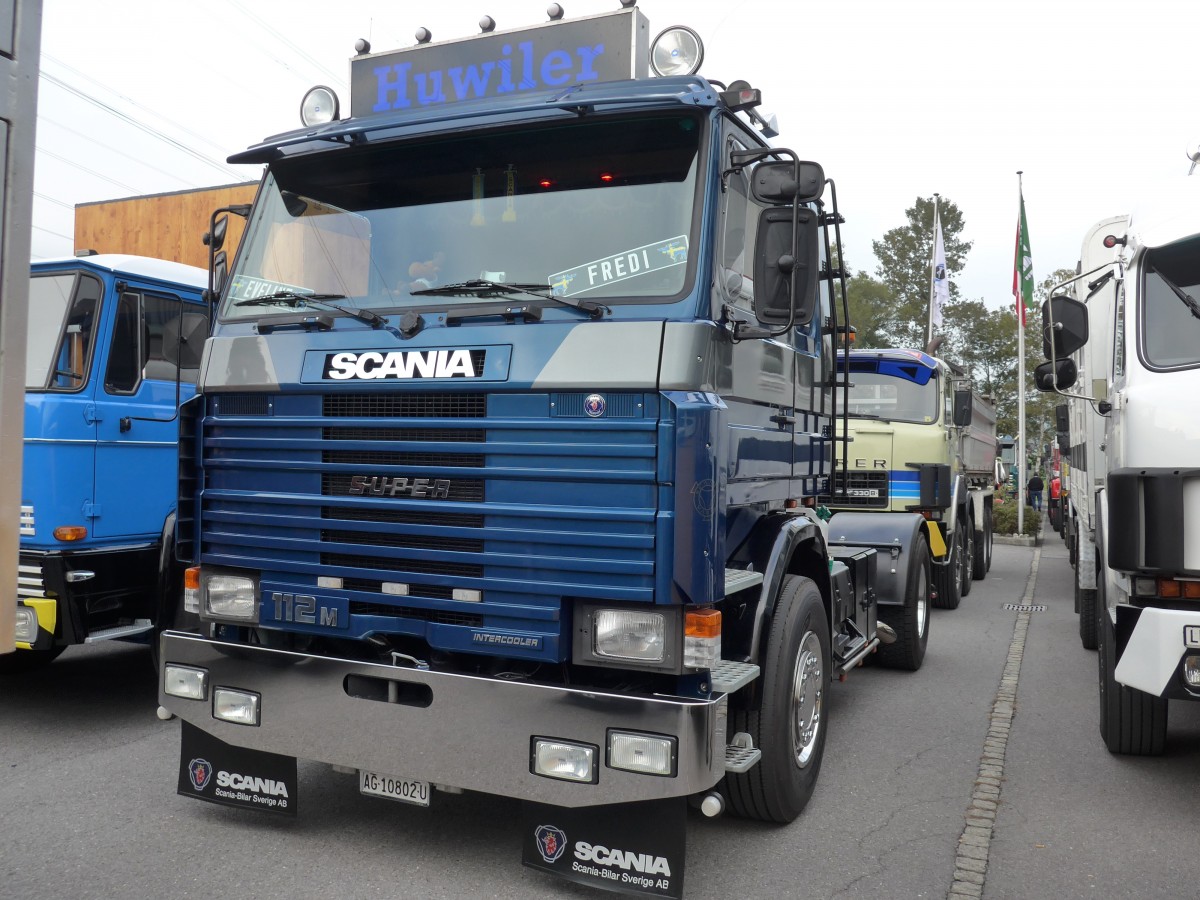 (166'098) - Huwiler - AG 10'802 U - Scania am 10. Oktober 2015 in Sch�nis, Bicoareal